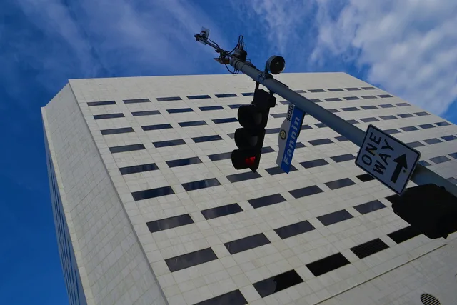 office building, federal building, skyscraper, structure, street sign, traffic signal, commercial, modern, contemporary city, tower, government, brick, property, meeting, business, corporate, rules, houston, texas. Business insurance benchmark research: matching geography, product and formula