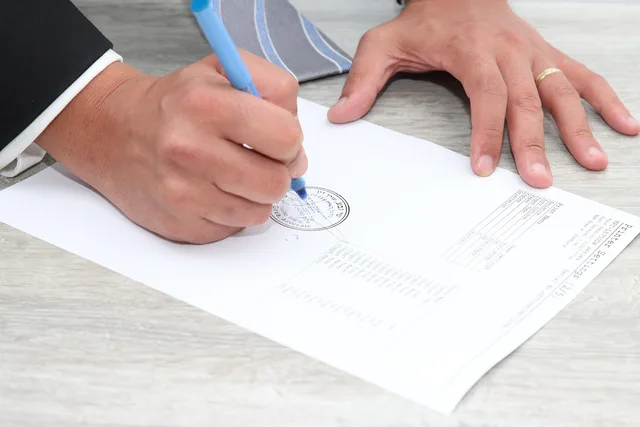 paper, document, stamp, signature, signing, deal, hands, signature, signature, signature, signature, signature. The insurance clauses in commercial contracts that catch parties out, from limits to run-off